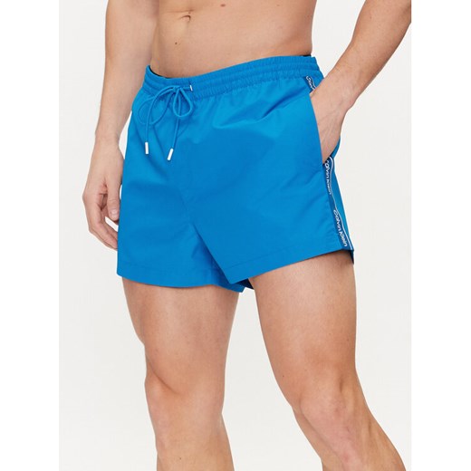 Calvin Klein Swimwear Szorty kąpielowe KM0KM00956 Niebieski Regular Fit ze sklepu MODIVO w kategorii Kąpielówki - zdjęcie 182759262