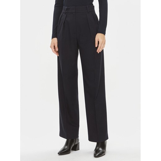 Tommy Hilfiger Spodnie materiałowe Core WW0WW39725 Granatowy Relaxed Fit ze sklepu MODIVO w kategorii Spodnie damskie - zdjęcie 182759480