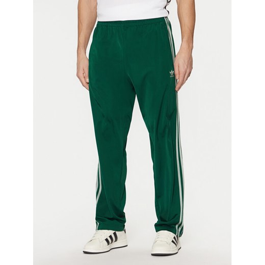 adidas Spodnie dresowe adicolor Classics Firebird JP2539 Zielony Regular Fit ze sklepu MODIVO w kategorii Spodnie męskie - zdjęcie 182760221