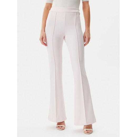 Guess Spodnie materiałowe W4YB01KCBO2 Różowy Flare Fit ze sklepu MODIVO w kategorii Spodnie damskie - zdjęcie 182761112