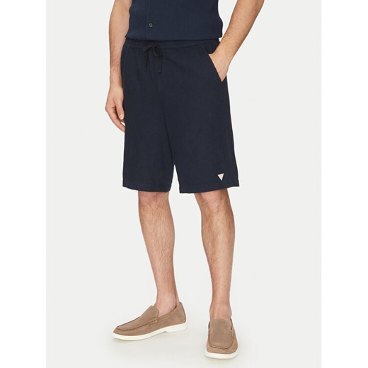 Guess Szorty materiałowe F5GD00 WH4J0 Granatowy Regular Fit ze sklepu MODIVO w kategorii Spodenki męskie - zdjęcie 182761963