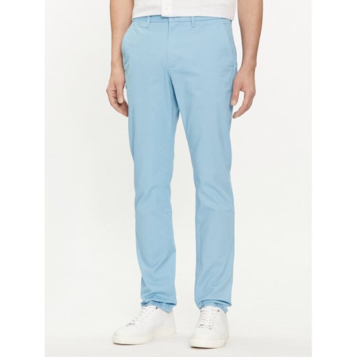 Tommy Hilfiger Chinosy Bleecker MW0MW26619 Błękitny Slim Fit ze sklepu MODIVO w kategorii Spodnie męskie - zdjęcie 182762054