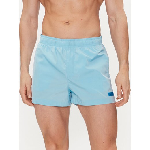 Calvin Klein Swimwear Szorty kąpielowe KM0KM00941 Błękitny Regular Fit ze sklepu MODIVO w kategorii Kąpielówki - zdjęcie 182764022