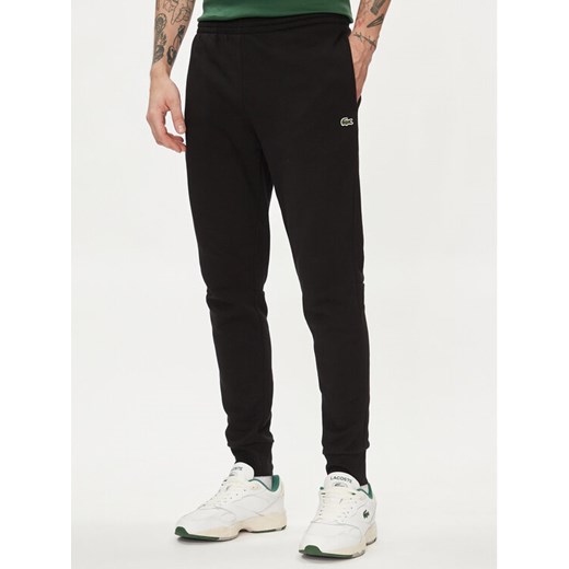 Lacoste Spodnie dresowe XH9624 Czarny Regular Fit ze sklepu MODIVO w kategorii Spodnie męskie - zdjęcie 182764901