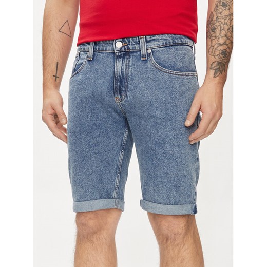 Tommy Jeans Szorty jeansowe Ronnie DM0DM19155 Niebieski Slim Fit ze sklepu MODIVO w kategorii Spodenki męskie - zdjęcie 182765351
