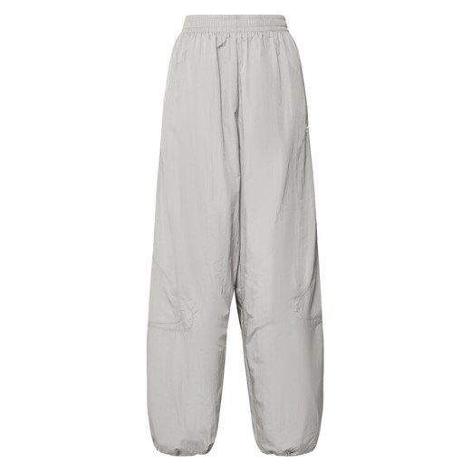 adidas Spodnie dresowe adicolor Teamgeist JD0258 Szary Oversize ze sklepu MODIVO w kategorii Spodnie damskie - zdjęcie 183578493