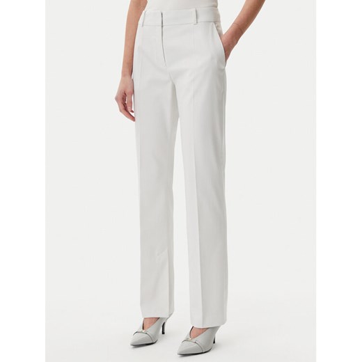 HUGO Spodnie materiałowe Hambori 50537747 Biały Slim Fit ze sklepu MODIVO w kategorii Spodnie damskie - zdjęcie 183602252