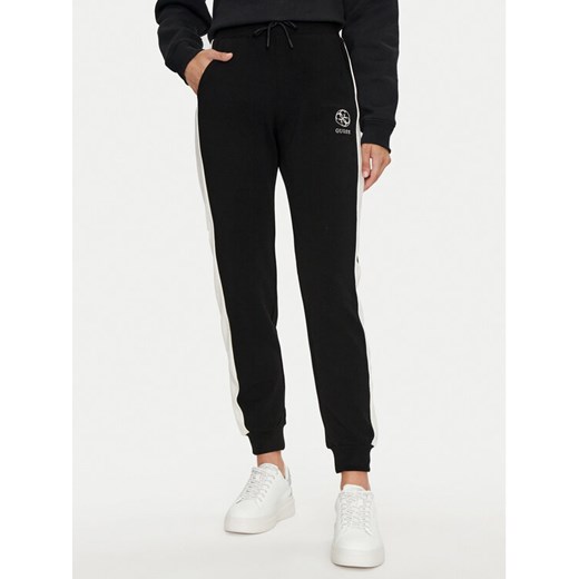 Guess Spodnie dresowe Elea V4YB02 KCDN0 Czarny Regular Fit ze sklepu MODIVO w kategorii Spodnie damskie - zdjęcie 183612473