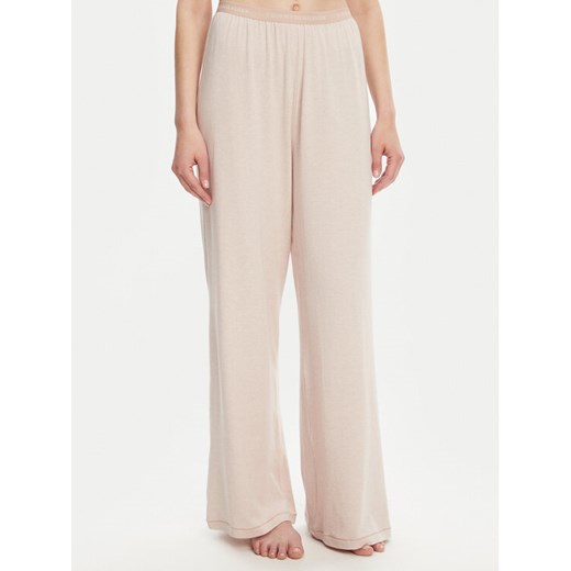 Tommy Hilfiger Spodnie piżamowe UW0UW05776 Beżowy Relaxed Fit ze sklepu MODIVO w kategorii Piżamy damskie - zdjęcie 183620133