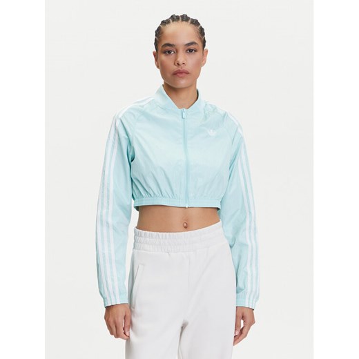 adidas Bluza adicolor Teamgeist JD0267 Turkusowy Slim Fit ze sklepu MODIVO w kategorii Bluzy damskie - zdjęcie 183620253