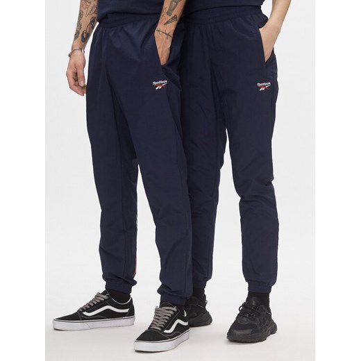 Reebok Spodnie dresowe Classics Vector Tracksuit Bottoms H54439 Niebieski Slim Fit ze sklepu MODIVO w kategorii Spodnie męskie - zdjęcie 183620363
