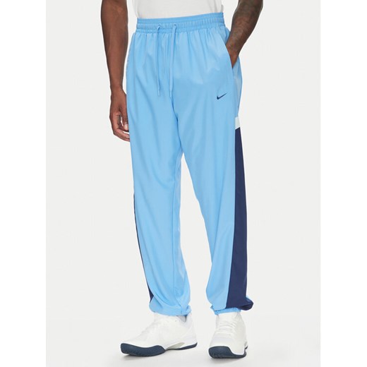 Nike Spodnie dresowe Icon FZ0250 Niebieski Relaxed Fit ze sklepu MODIVO w kategorii Spodnie męskie - zdjęcie 183652972