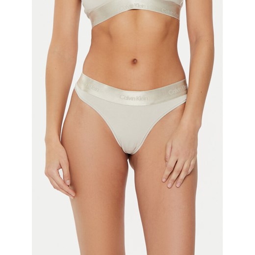 Calvin Klein Underwear Stringi 000QF7997E Beżowy ze sklepu MODIVO w kategorii Majtki damskie - zdjęcie 183660313