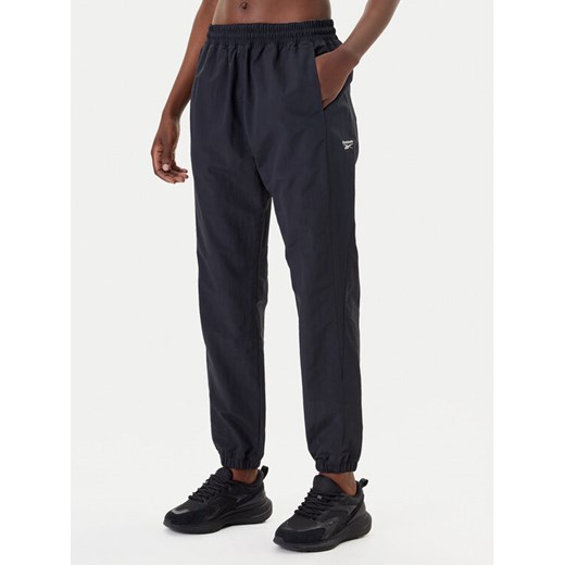 Reebok Spodnie dresowe Vector 100221435 Czarny Relaxed Fit ze sklepu MODIVO w kategorii Spodnie damskie - zdjęcie 183701334