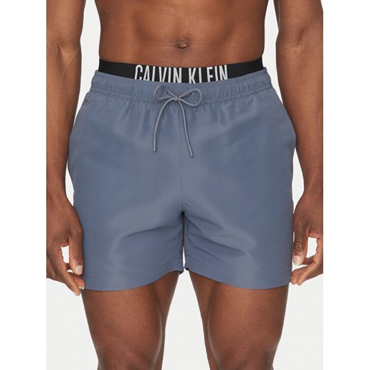 Calvin Klein Swimwear Szorty kąpielowe KM0KM01093 Szary Regular Fit ze sklepu MODIVO w kategorii Kąpielówki - zdjęcie 183737162