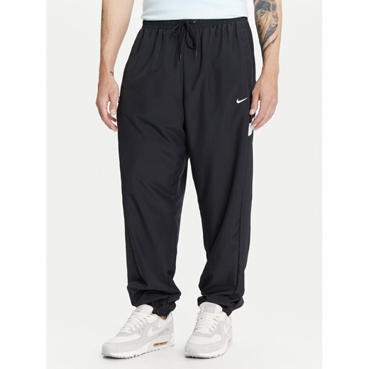 Nike Spodnie dresowe Icon FZ0250 Czarny Regular Fit ze sklepu MODIVO w kategorii Spodnie męskie - zdjęcie 183751622