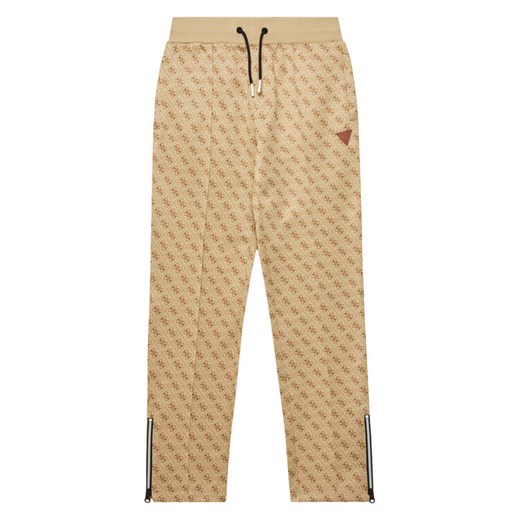 Guess Spodnie dresowe L4YQ18 FL04Q Beżowy Regular Fit ze sklepu MODIVO w kategorii Spodnie chłopięce - zdjęcie 183814044
