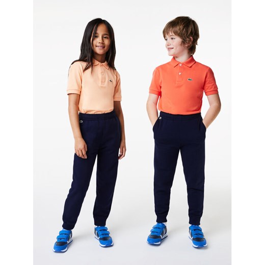 Lacoste Spodnie dresowe XJ9728 Granatowy Regular Fit ze sklepu MODIVO w kategorii Spodnie dziewczęce - zdjęcie 183851770