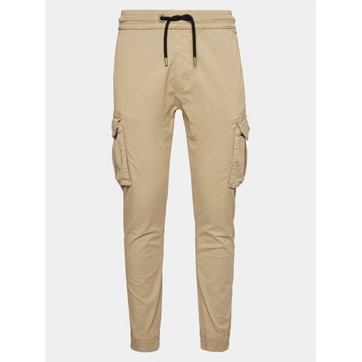 Alpha Industries Joggery Twill 116202 Beżowy Slim Taper Fit ze sklepu MODIVO w kategorii Spodnie męskie - zdjęcie 183862861