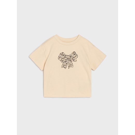 Sinsay - Koszulka z nadrukiem kokardy - kremowy Sinsay 98 (2-3 l) Sinsay