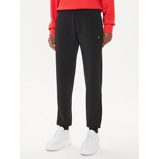 Guess Spodnie dresowe V4YB08 KCAY2 Czarny Regular Fit ze sklepu MODIVO w kategorii Spodnie damskie - zdjęcie 183874752