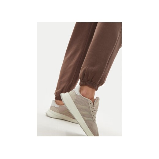 adidas Spodnie dresowe adicolor Essentials IR5974 Brązowy Regular Fit M MODIVO