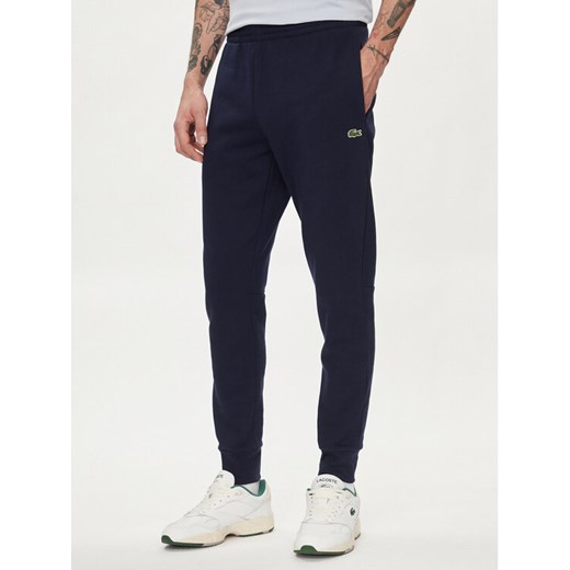 Lacoste Spodnie dresowe XH9624 Granatowy Regular Fit ze sklepu MODIVO w kategorii Spodnie męskie - zdjęcie 183946762