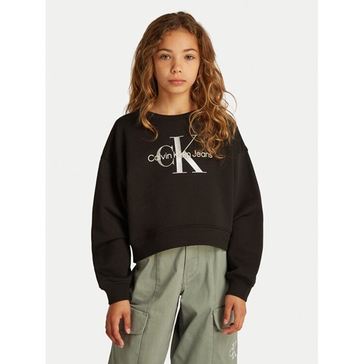 Calvin Klein Jeans Bluza Glitter Monologo IG0IG02823 D Czarny Boxy Fit ze sklepu MODIVO w kategorii Bluzy dziewczęce - zdjęcie 183946990