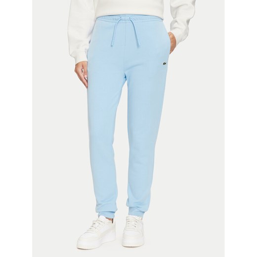 Lacoste Spodnie dresowe XF9216 Niebieski Regular Fit ze sklepu MODIVO w kategorii Spodnie damskie - zdjęcie 183947454