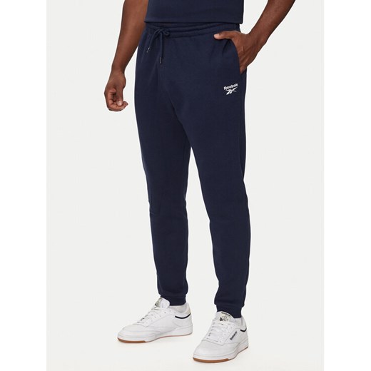Reebok Spodnie dresowe HH8325 Granatowy Regular Fit ze sklepu MODIVO w kategorii Spodnie męskie - zdjęcie 183948294
