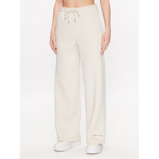 Calvin Klein Jeans Spodnie dresowe J20J221296 Écru Relaxed Fit M MODIVO
