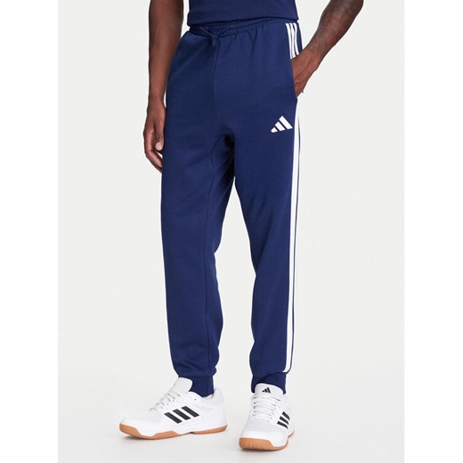adidas Spodnie dresowe Essentials 3-Stripes JD1859 Niebieski Regular Fit ze sklepu MODIVO w kategorii Spodnie męskie - zdjęcie 184019321