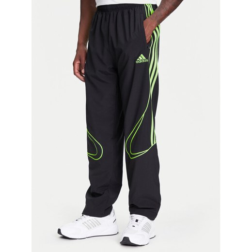adidas Spodnie dresowe Teamgeist adicolor JW5869 Czarny Loose Fit ze sklepu MODIVO w kategorii Spodnie męskie - zdjęcie 184019452