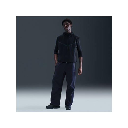 Męskie spodnie oversize z tkaniny Nike Tech - Niebieski ze sklepu Nike poland w kategorii Spodnie męskie - zdjęcie 184264541