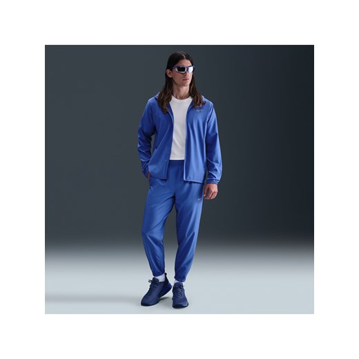 Męskie uniwersalne spodnie ze zwężanymi nogawkami Dri-FIT Nike Form - Niebieski ze sklepu Nike poland w kategorii Spodnie męskie - zdjęcie 184264842