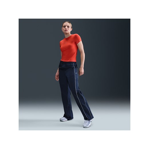 Damskie spodnie z tkaniny z wysokim stanem i luźnymi nogawkami Nike Windrunner - Niebieski ze sklepu Nike poland w kategorii Spodnie damskie - zdjęcie 184264951