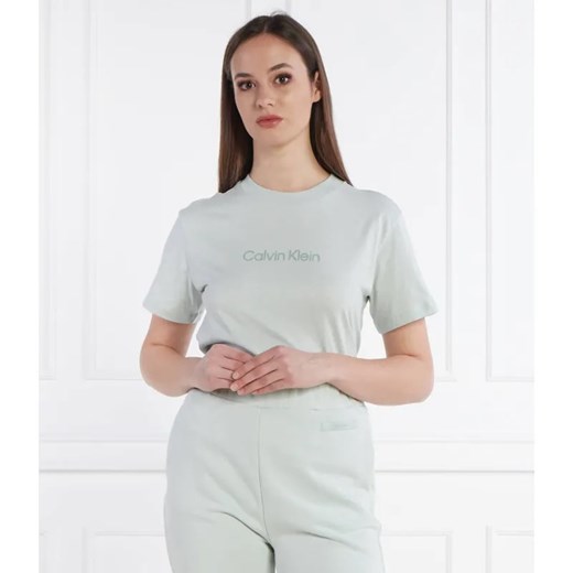 Calvin Klein T-shirt HERO LOGO | Regular Fit ze sklepu Gomez Fashion Store w kategorii Bluzki damskie - zdjęcie 184340913