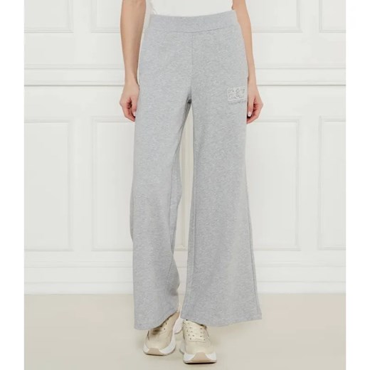 EA7 Spodnie dresowe | flare fit ze sklepu Gomez Fashion Store w kategorii Spodnie damskie - zdjęcie 184504633