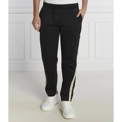 Calvin Klein Jeans Spodnie dresowe CUT OFF LOGO TAPE | Regular Fit S Gomez Fashion Store promocyjna cena