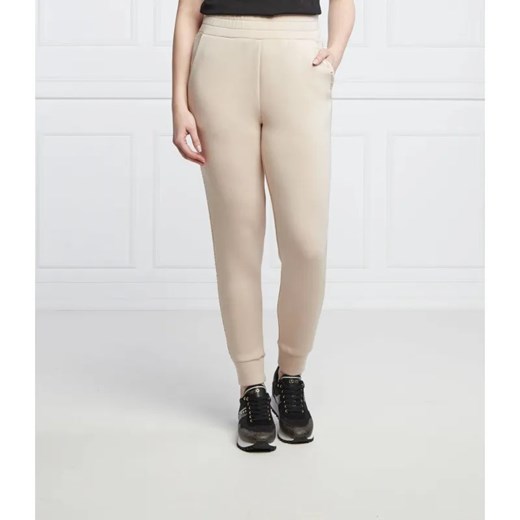 GUESS Spodnie dresowe SIMONNE | Regular Fit ze sklepu Gomez Fashion Store w kategorii Spodnie damskie - zdjęcie 184505720