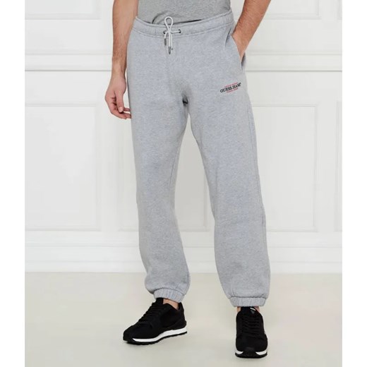 Guess Jeans Spodnie dresowe AMERICAN | Regular Fit ze sklepu Gomez Fashion Store w kategorii Spodnie męskie - zdjęcie 184509390