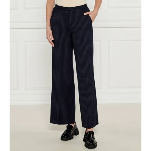 Calvin Klein Spodnie | flare fit | z dodatkiem wełny ze sklepu Gomez Fashion Store w kategorii Spodnie damskie - zdjęcie 184511444