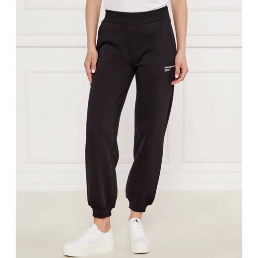 Calvin Klein Jeans Spodnie dresowe GALAXY PRINT | Comfort fit ze sklepu Gomez Fashion Store w kategorii Spodnie damskie - zdjęcie 184511550