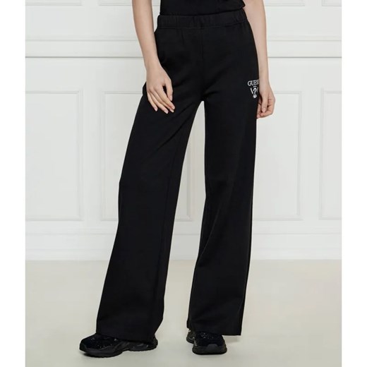 GUESS ACTIVE Spodnie dresowe ROBERTA | flare fit ze sklepu Gomez Fashion Store w kategorii Spodnie damskie - zdjęcie 184514662