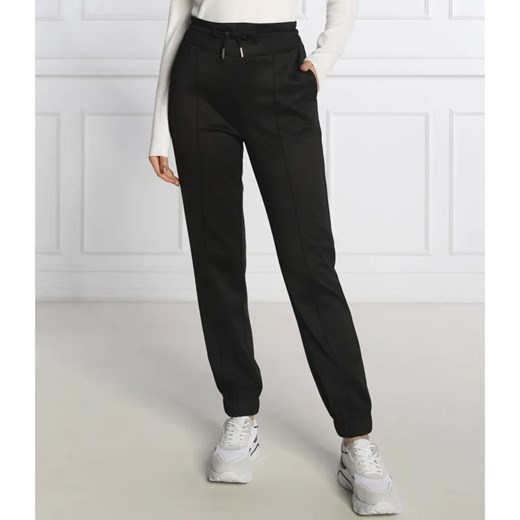 GUESS Spodnie dresowe ARMELLE | Regular Fit ze sklepu Gomez Fashion Store w kategorii Spodnie damskie - zdjęcie 184519371