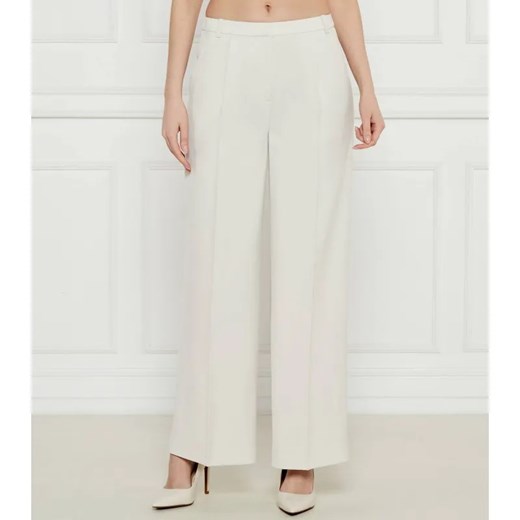 Calvin Klein Spodnie | flare fit | mid rise ze sklepu Gomez Fashion Store w kategorii Spodnie damskie - zdjęcie 184520312