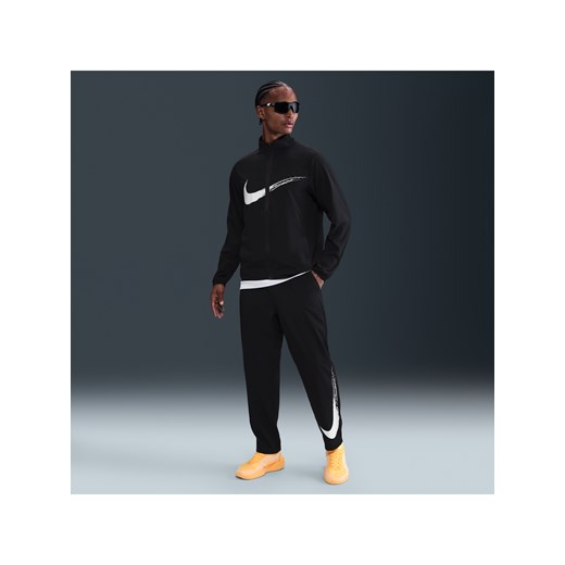 Męskie uniwersalne spodnie z luźnymi nogawkami Dri-FIT Nike Form - Czerń ze sklepu Nike poland w kategorii Spodnie męskie - zdjęcie 184551170