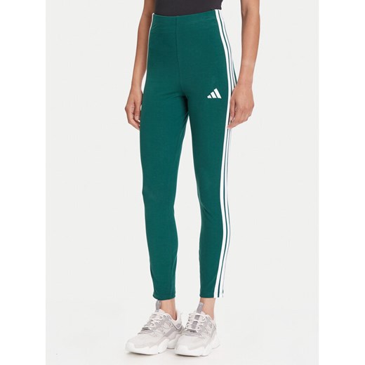 adidas Legginsy Essentials 3-Stripes KB7663 Zielony Slim Fit ze sklepu MODIVO w kategorii Spodnie damskie - zdjęcie 184562294