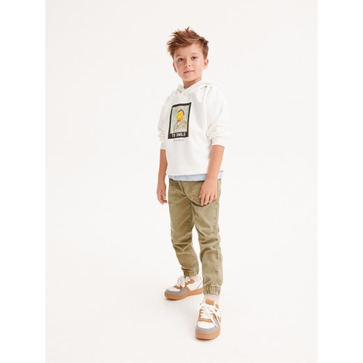 Reserved - Bluza oversize SmileyWorld® - złamana biel Reserved 146 (10 lat) wyprzedaż Reserved