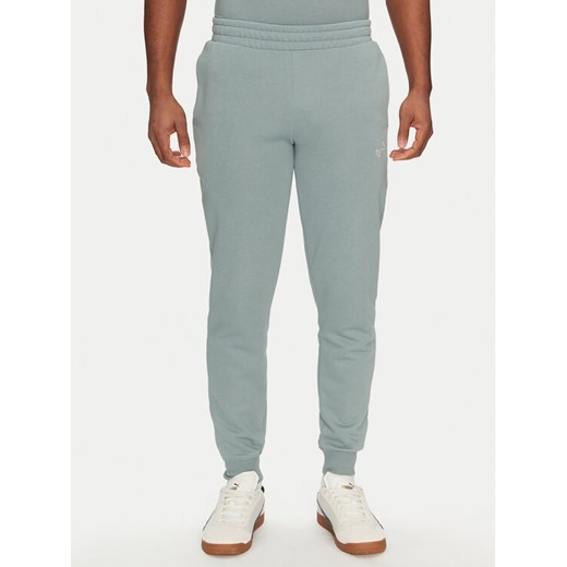 Puma Spodnie dresowe Ess 684714 Zielony Regular Fit ze sklepu MODIVO w kategorii Spodnie męskie - zdjęcie 184608170